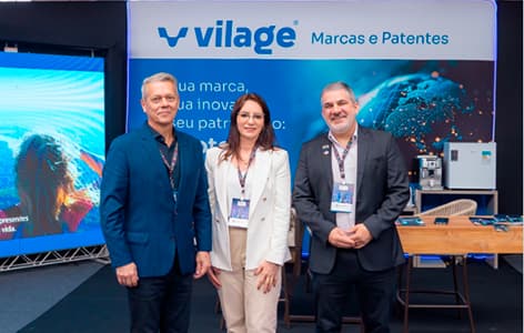 Equipe da VILAGE Marcas e Patentes em estande de evento empresarial
